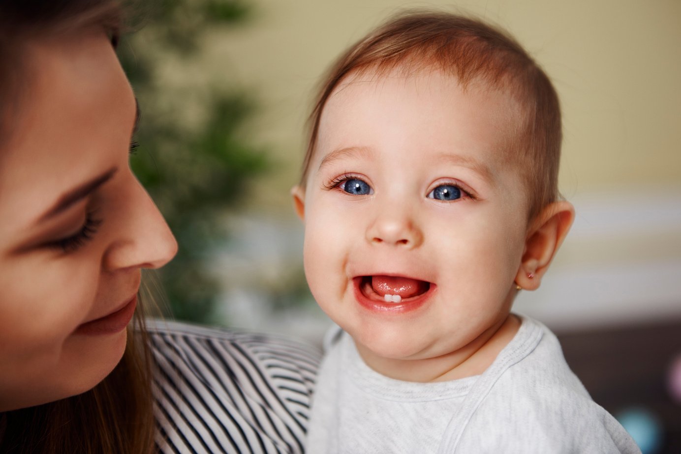 Smiling Baby Showing Primary Teeth